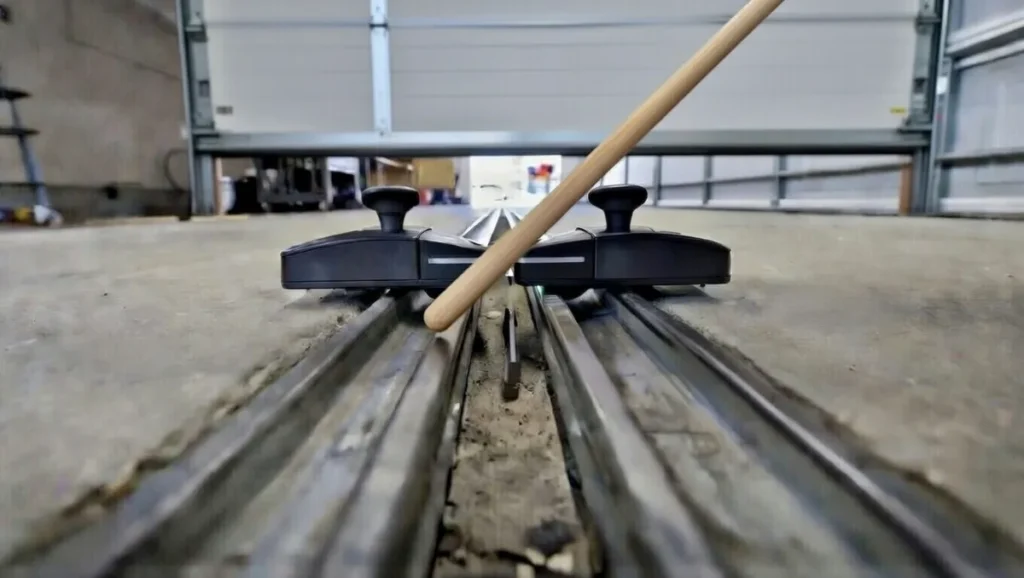  testing garage door safety sensors with broom handle