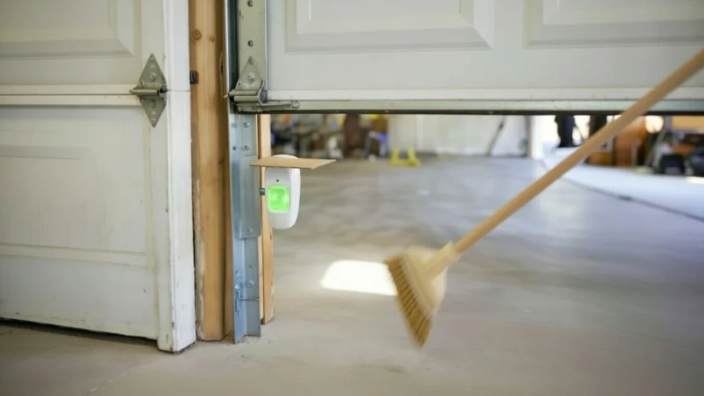 testing garage door safety sensor reverse with broom handle
