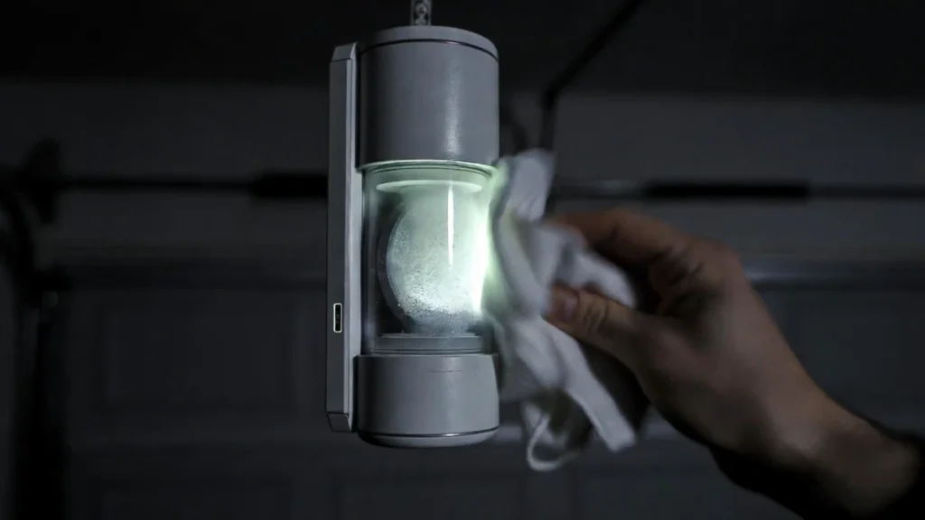 wiping condensation from garage door sensor lens