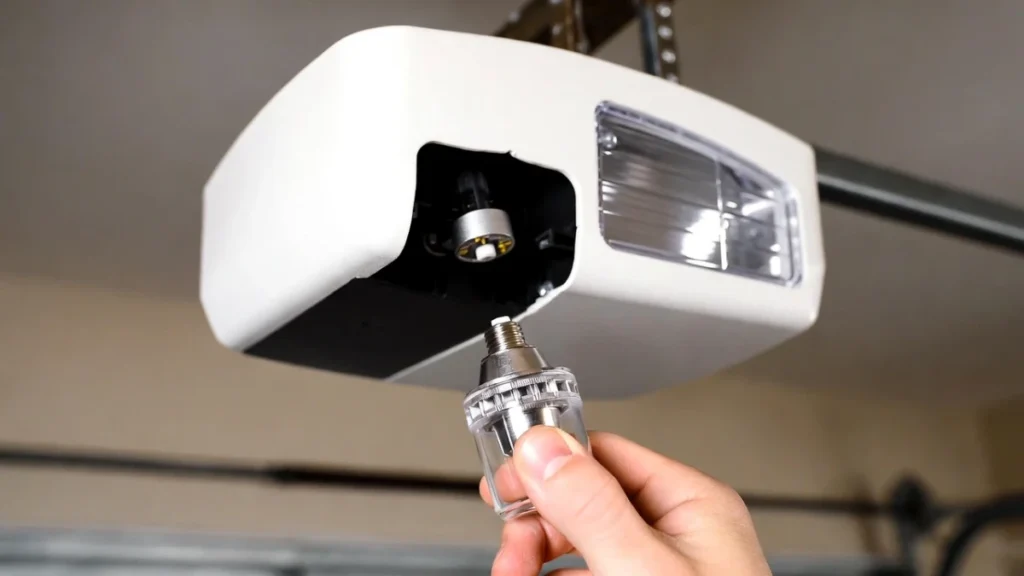 changing garage door opener light bulb to fix light staying on