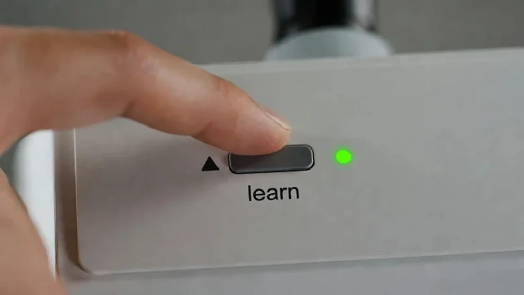 pressing learn button to put opener in programming mode