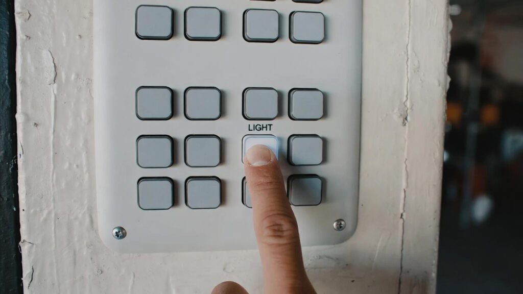 garage wall control button stuck causing opener light to stay on