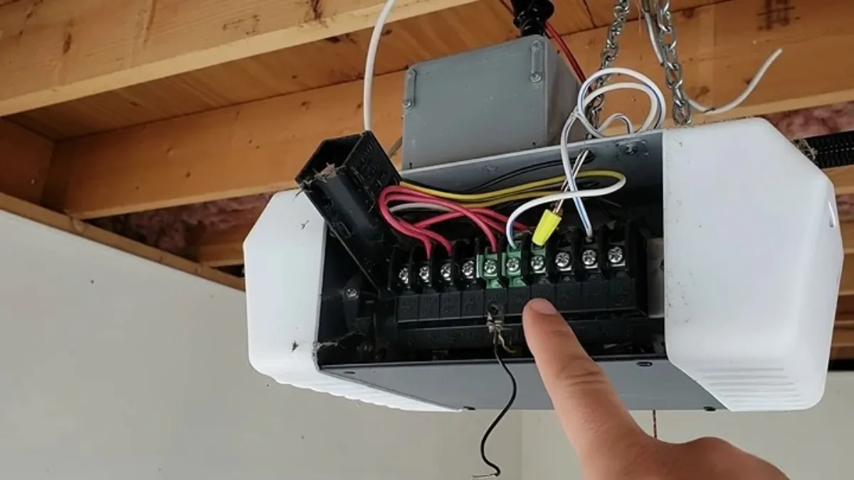 checking sensor wire connections at garage door opener terminals